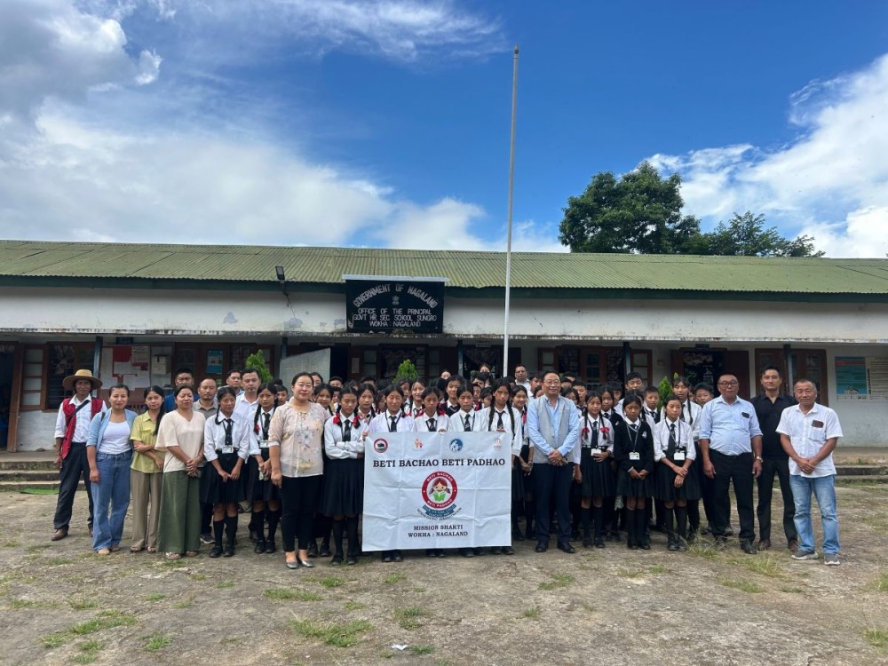 Deputy Commissioner Wokha K Mhathung Tsanglao, along with Senior SDEO Wokha Nchumbemo Jami, officials of Mission Shakti and students, during a visit to Sungro GHSS on September 22. (Morung Photo)